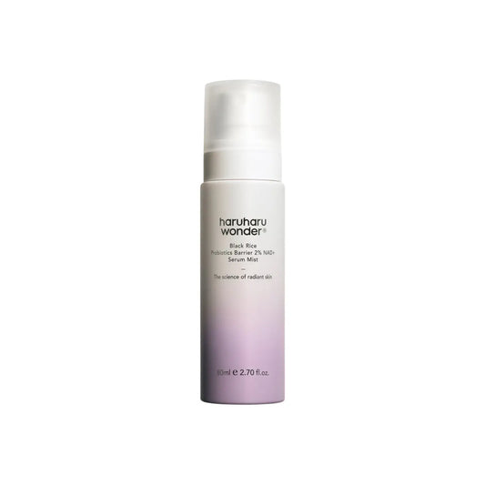 A sleek gradient purple to white cylindrical bottle of haruharu wonder black rice probiotics barrier 2% nad serum mist