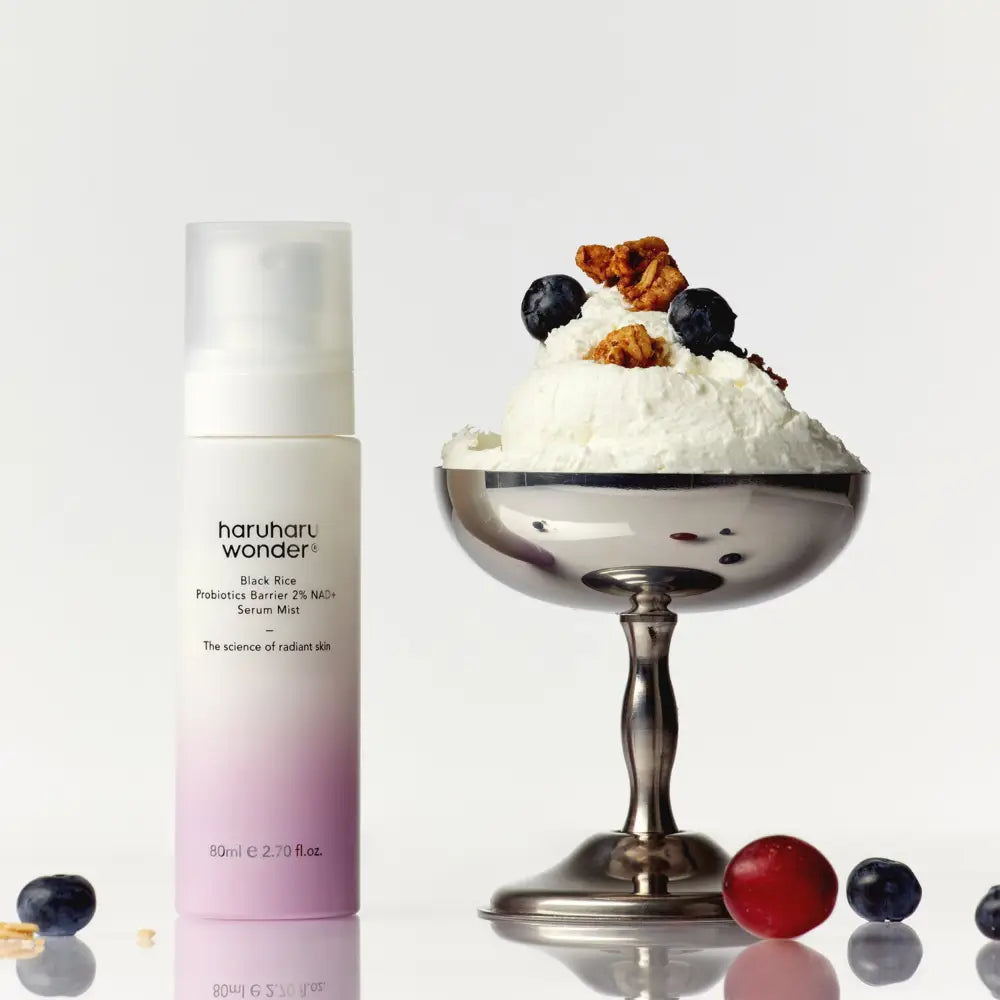 A sleek 80ml frosted glass bottle of haruharu wonder black rice probiotics barrier 2% NAD serum mist with ferment filtrate
