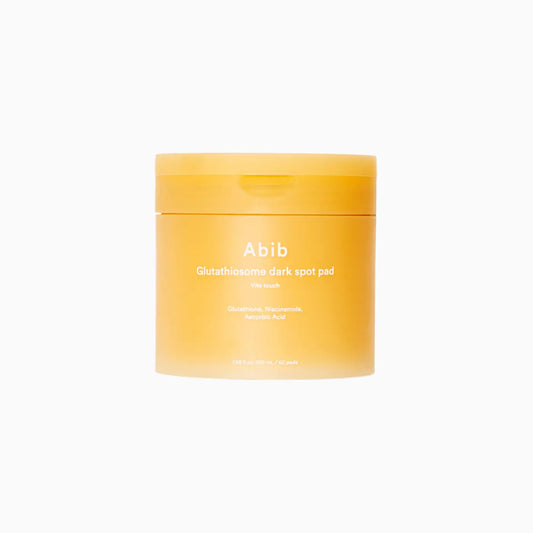 A vibrant orange abib glutathiosome dark spot pad jar with white labeling for brightening vitamin c toner use