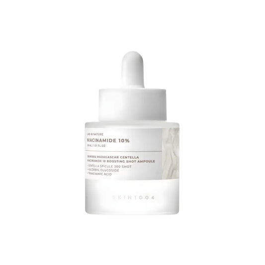 Clear glass bottle with white dropper and minimalist label highlighting niacinamide 10 for madagascar centella niacinamide boosting shot ampoule