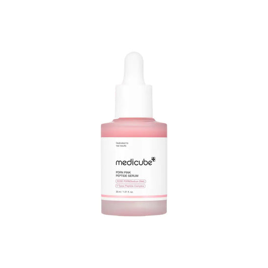 A translucent pink glass bottle of medicube pdrn pink peptide serum 30ml with a white dropper cap and minimalist label