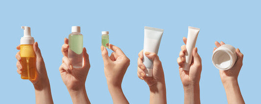 A hand holds a clear glass pump bottle with amber liquid highlighting gentle formulations for acne-prone skin by korean skincare brand.