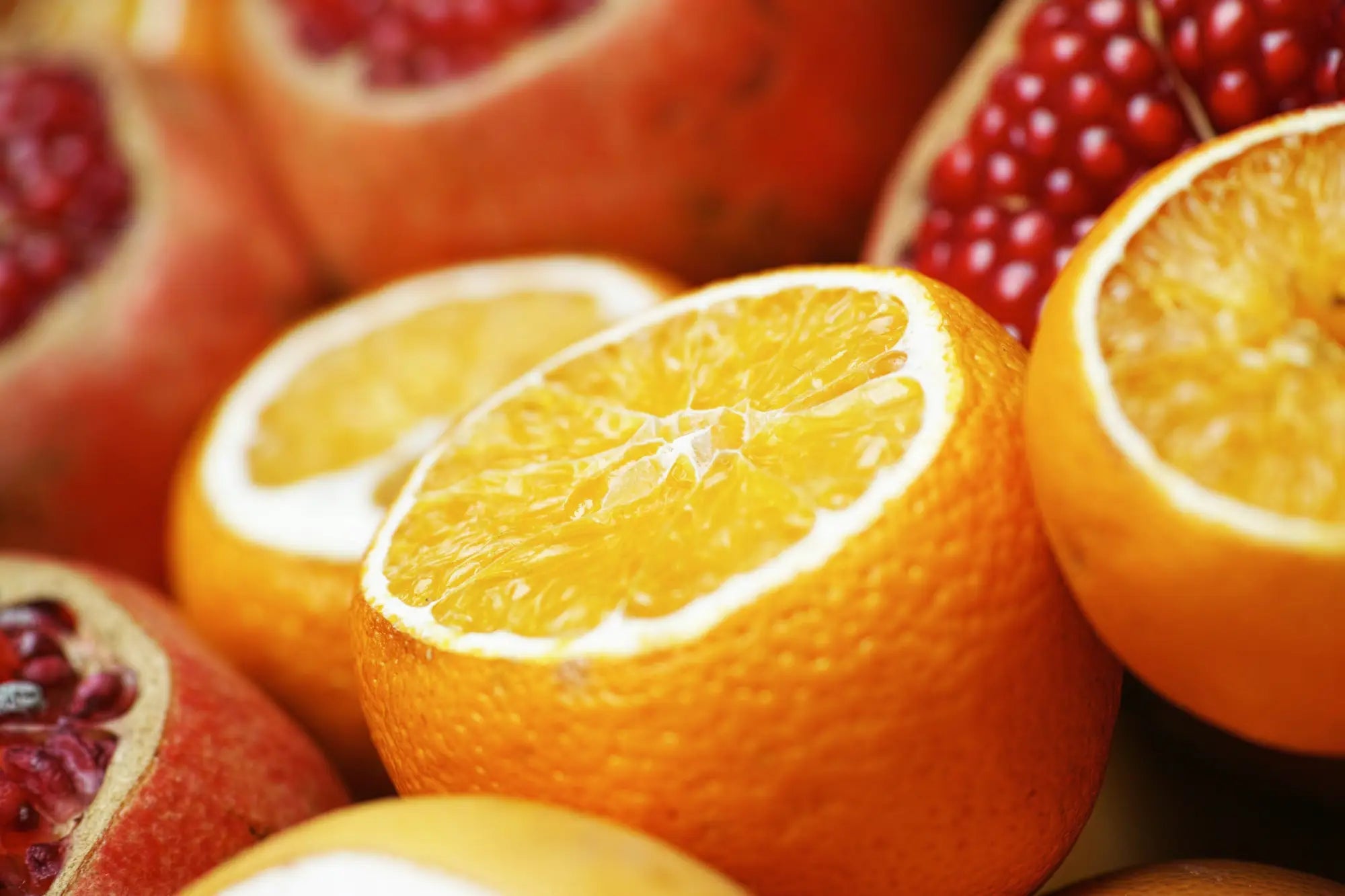 A vibrant orange sliced to reveal juicy yellow flesh illustrating vitamin c benefits in korean skincare south africa.