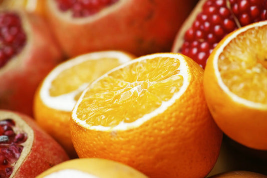 A vibrant orange sliced to reveal juicy yellow flesh illustrating vitamin c benefits in korean skincare south africa.