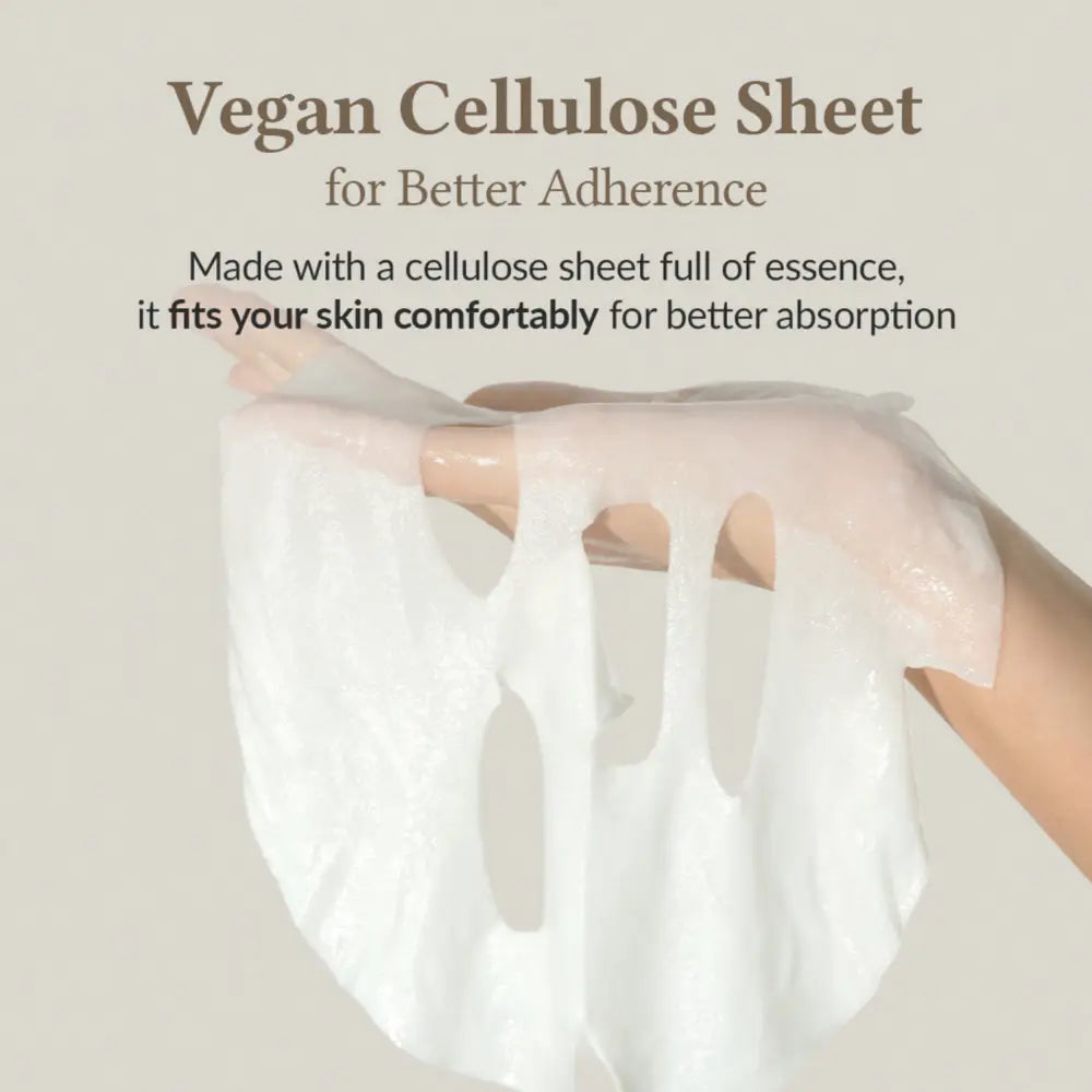 A translucent white vegan cellulose relief cream mask with eye and nose cutouts for gentle skin adherence