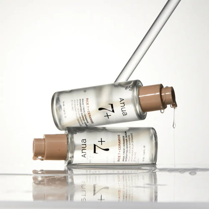 Clear glass bottle with beige pump dispenser labeled anua 7 rice ceramide hydrating barrier serum 50ml