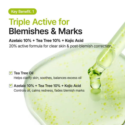 A clear glass dropper dispenses light green azelaic acid 10 kojic tea tree serum into a shallow bowl
