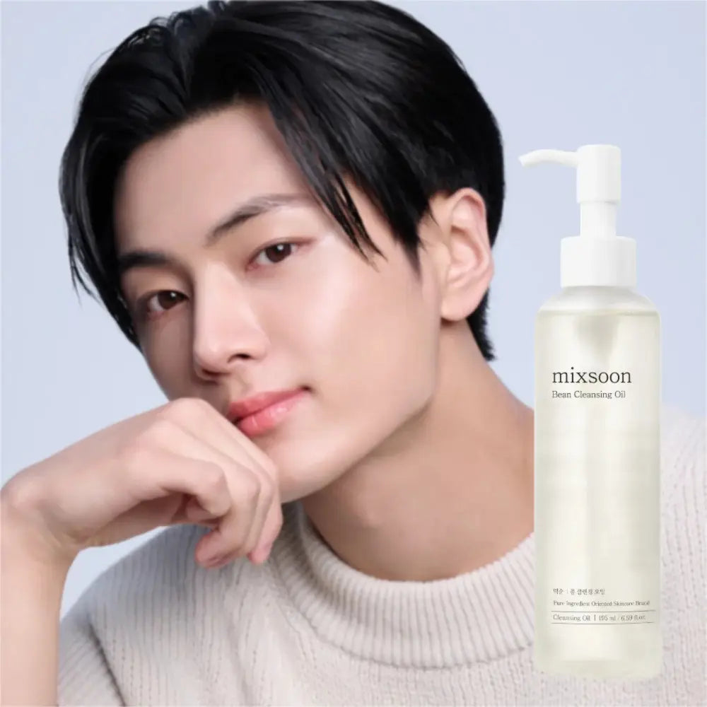 A clear glass bottle with a white pump dispenser containing pale yellow mixsoon bean cleansing oil 195ml