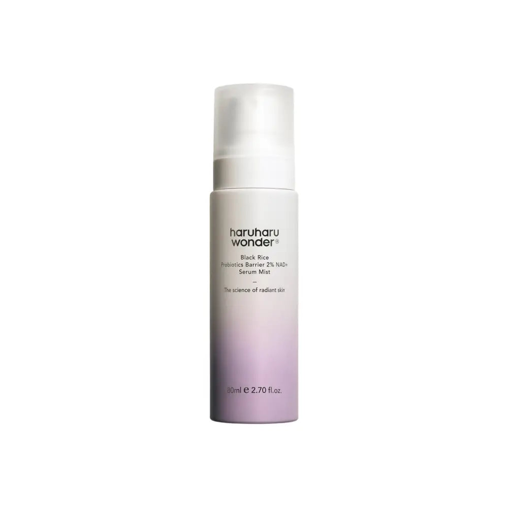 A sleek gradient purple-to-white cylindrical bottle of haruharu wonder black rice probiotics barrier 2% nad+ serum mist with ferment filtrate