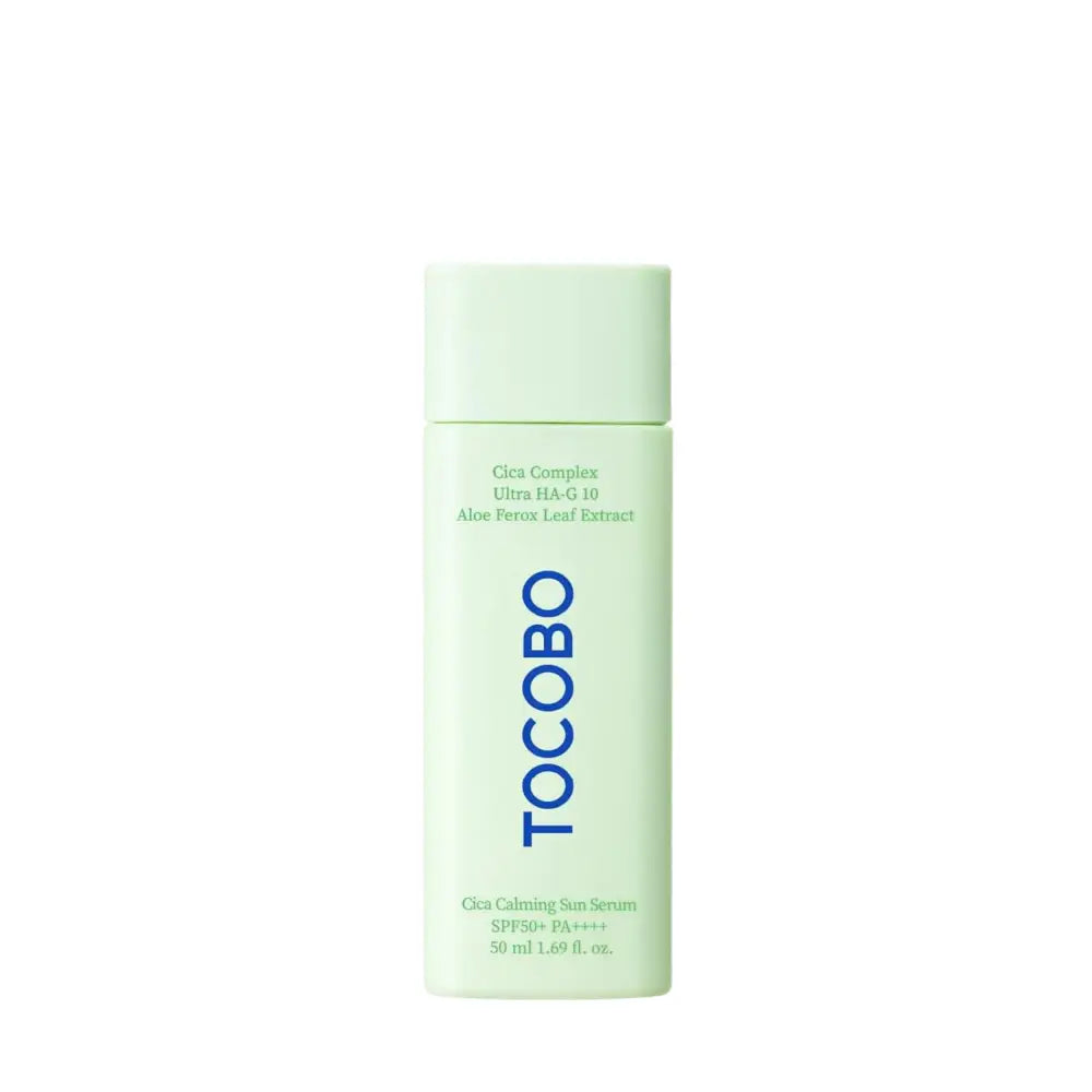 A sleek light mint-green cylindrical tocobo cica calming sun serum bottle with bold blue lettering and matching cap