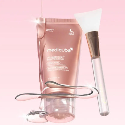 Rose gold medicube collagen night wrapping mask 75ml with white silicone brush and silver facial roller beside it