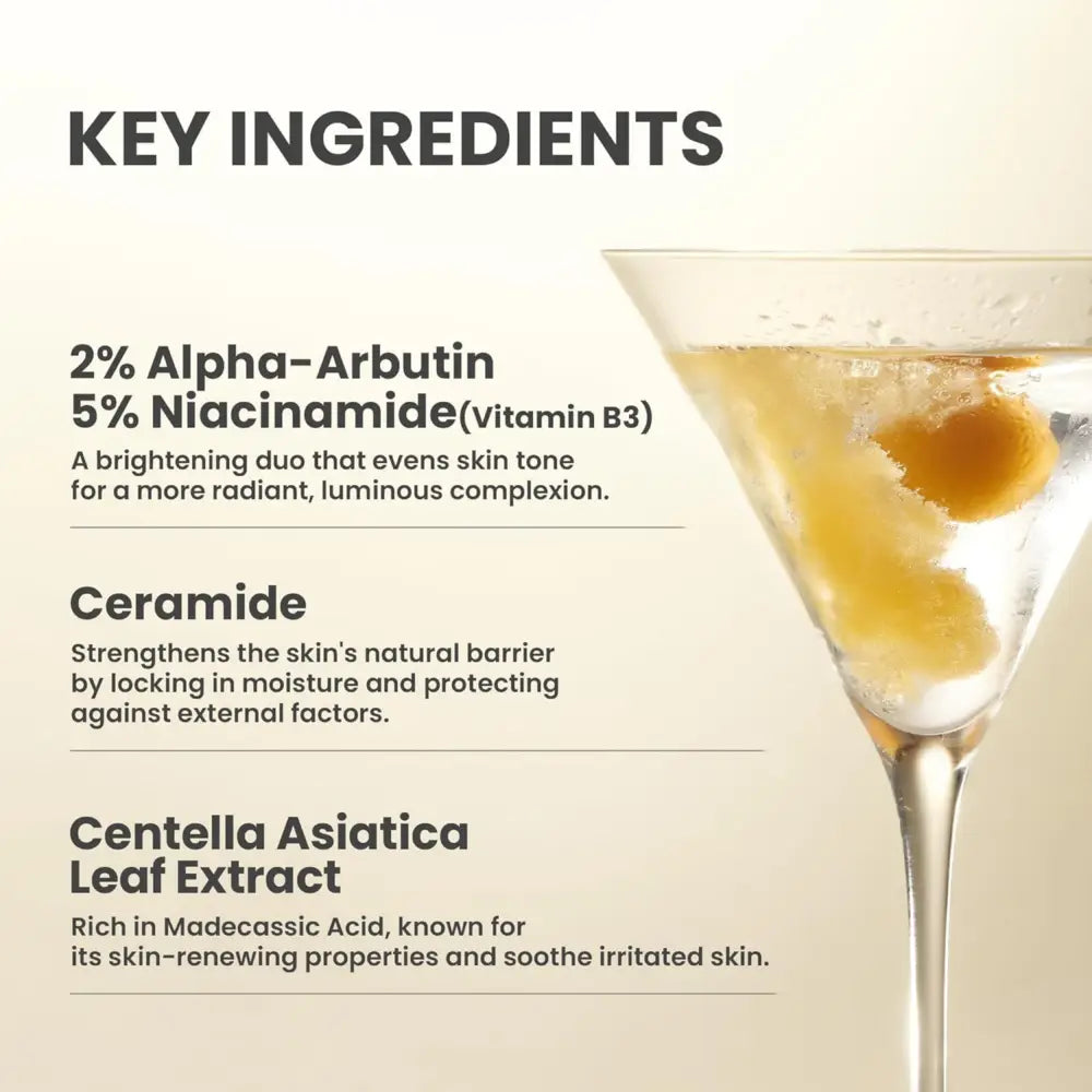 A martini glass with golden liquid and ice representing the dark spot correcting glow cream from authentic korean skincare south africa