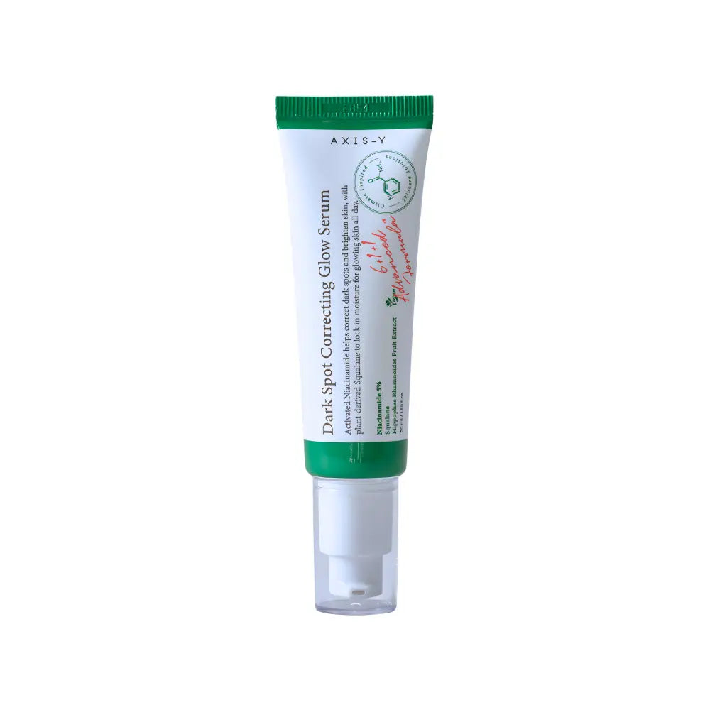 Green-topped white tube of axis-y dark spot correcting glow serum with clear pump for moisture barrier care