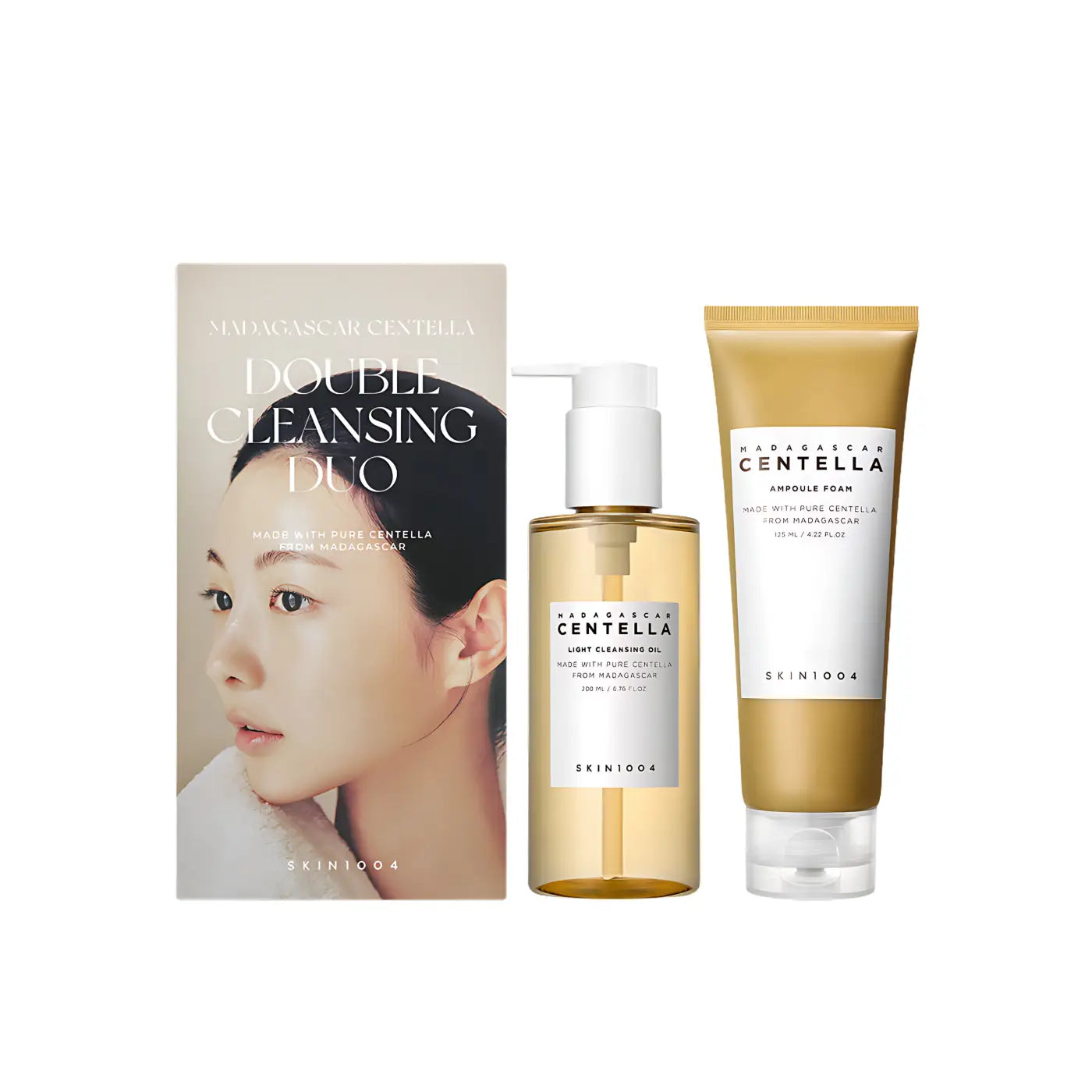 Gold-tinted glass bottle with white pump dispenser containing light cleansing oil from skin1004 madagascar centella duo