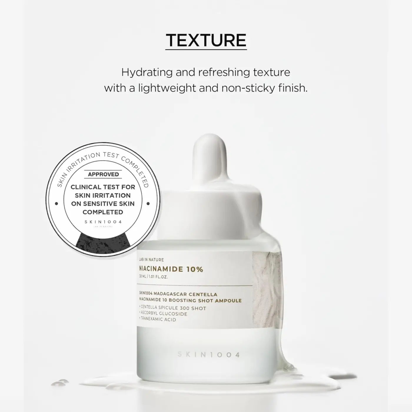 White glass bottle with dropper cap labeled niacinamide 10% by skin1004 madagascar centella niacinamide boosting shot ampoule