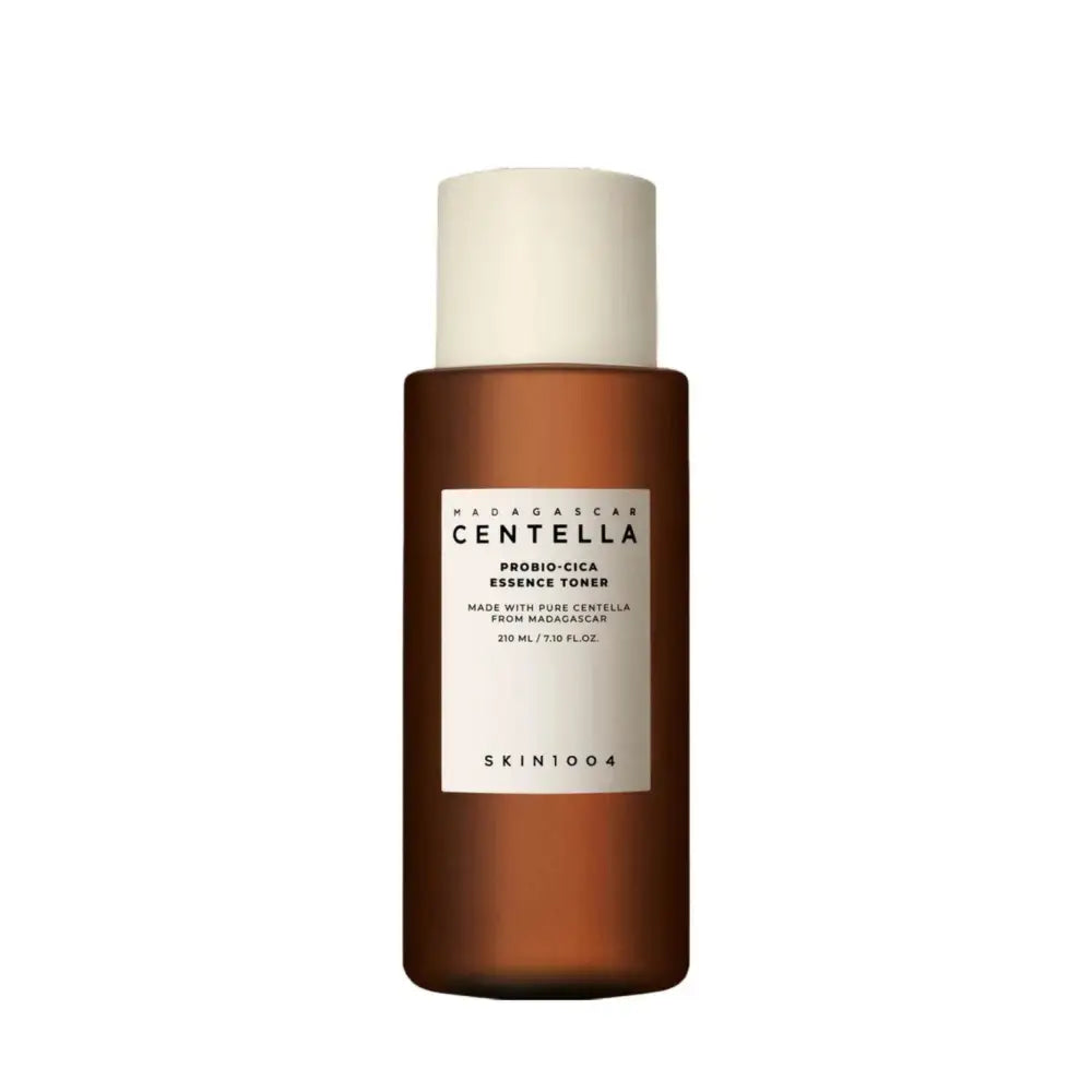 A sleek amber glass bottle with matte white cap and minimalist label of madagascar centella probio-cica essence toner 210ml