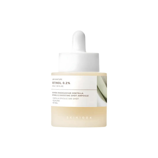 Minimalist white dropper bottle with translucent amber liquid labeled skin1004 madagascar centella retinol 0.2 boosting shot ampoule 30ml