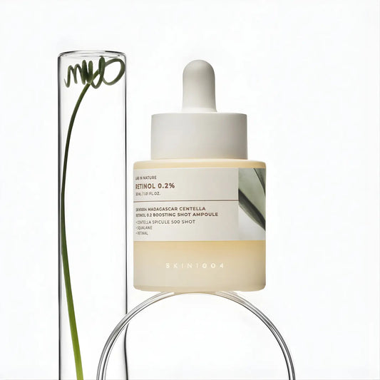 A minimalist white dropper bottle of skin1004 madagascar centella retinol boosting shot ampoule 30ml with pale yellow liquid