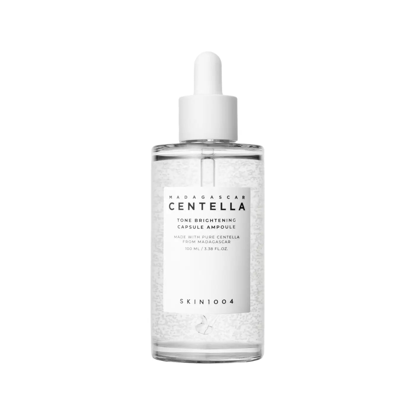 Clear glass bottle with white dropper cap containing madagascar centella brightening capsule ampoule with visible beads