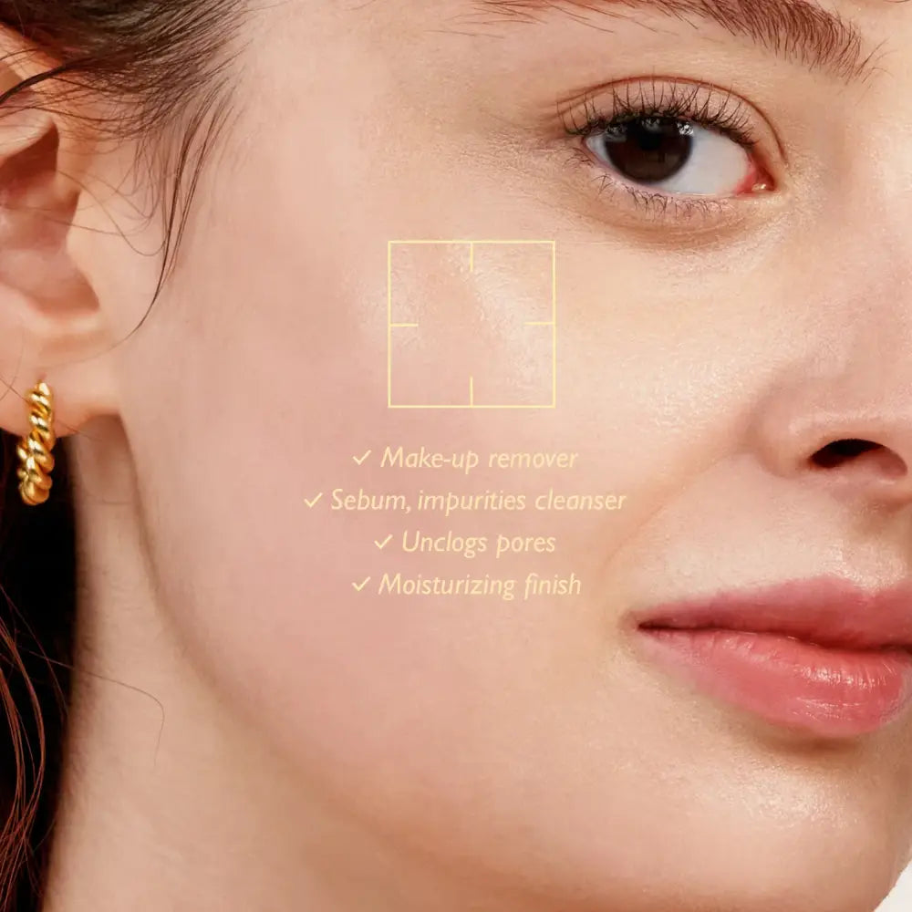 Gold twisted hoop earring next to moisture cleansing oil unscented for best korean skincare brands sa routine