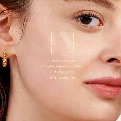Gold twisted hoop earring next to moisture cleansing oil unscented for best korean skincare brands sa routine