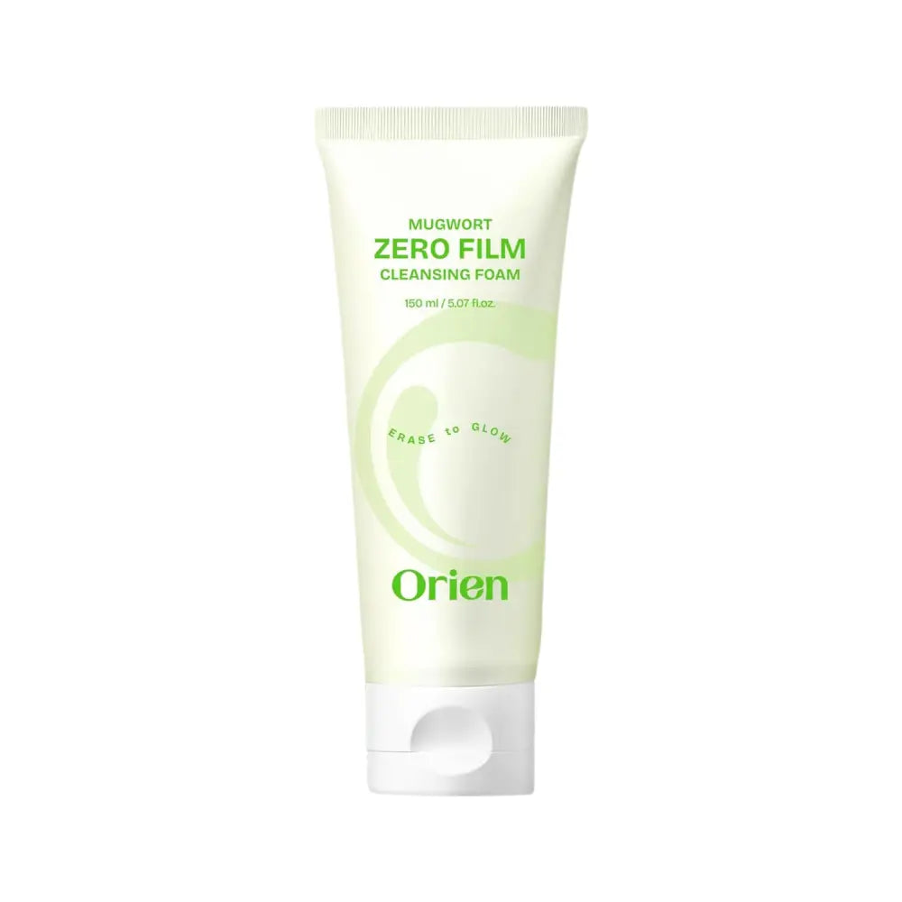 A sleek translucent white tube of orien mugwort zero film cleansing foam with a minimalist green label and cap