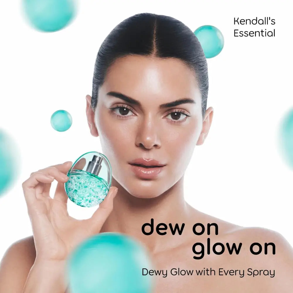 A translucent turquoise serum spray bottle with silver cap and sparkling design labeled anya for pdrn collagen glow facial use