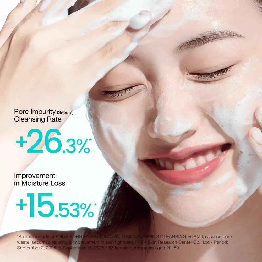A woman applying white foamy pdrn hyaluronic acid moisturizing cleansing foam 150ml to her face for hydration and cleansing