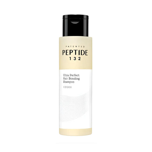A sleek minimalist cosrx peptide 132 ultra perfect hair bonding shampoo bottle with a black flip-top cap and beige label