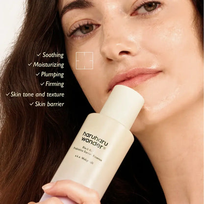 A sleek off-white cylindrical bottle of haruharu wonder black rice probiotics barrier essence 120ml authentic k-beauty