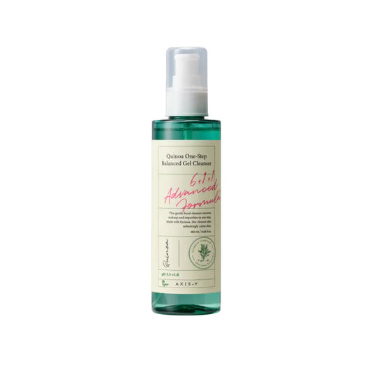 A clear glass bottle with a white pump containing translucent green axis y quinoa one-step balanced gel cleanser