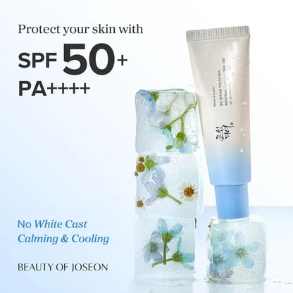 A translucent blue gradient tube of beauty of joseon relief sun aqua-fresh sunscreen with rice seed water and icy floral design