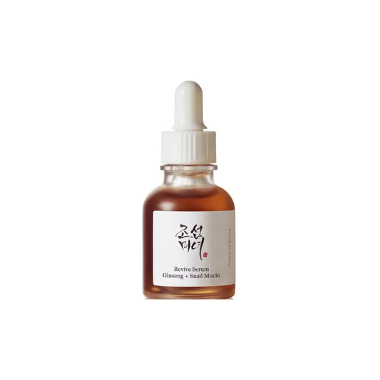 A clear glass bottle of amber revive serum with ginseng root water and snail mucin by joishim skincare brand