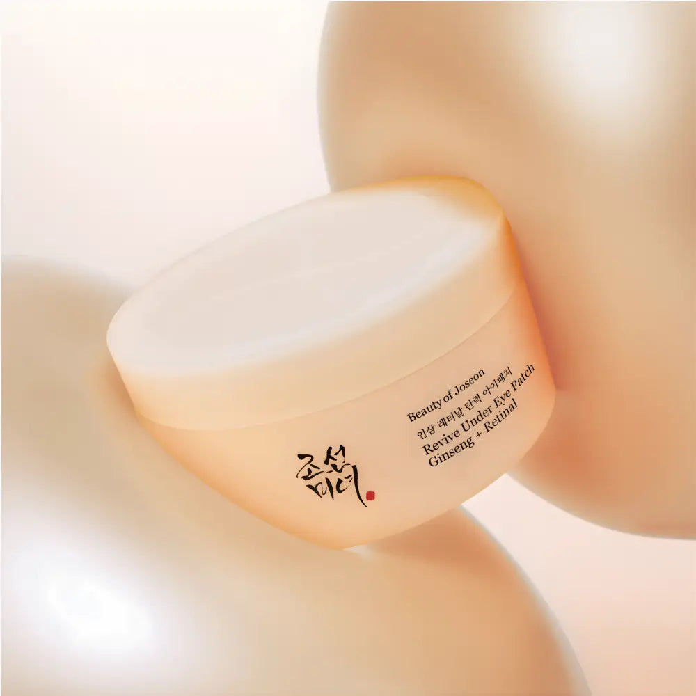 A soft peach translucent jar of Beauty of Joseon Revive Under Eye Patch with ginseng water for skincare South Africa