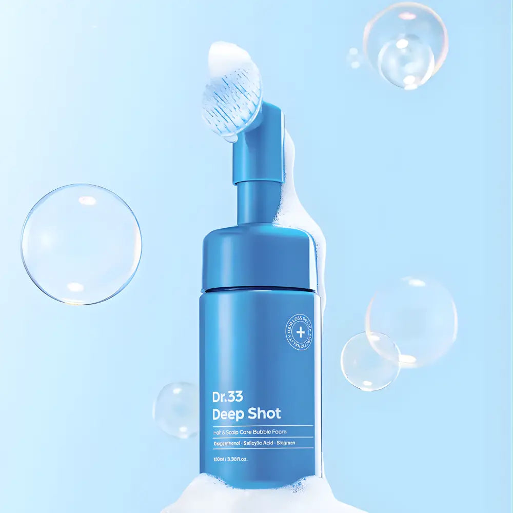 Scalpy bubble tonic 100ml bubble foam in a sleek blue pump bottle surrounded by bubbles on light blue background