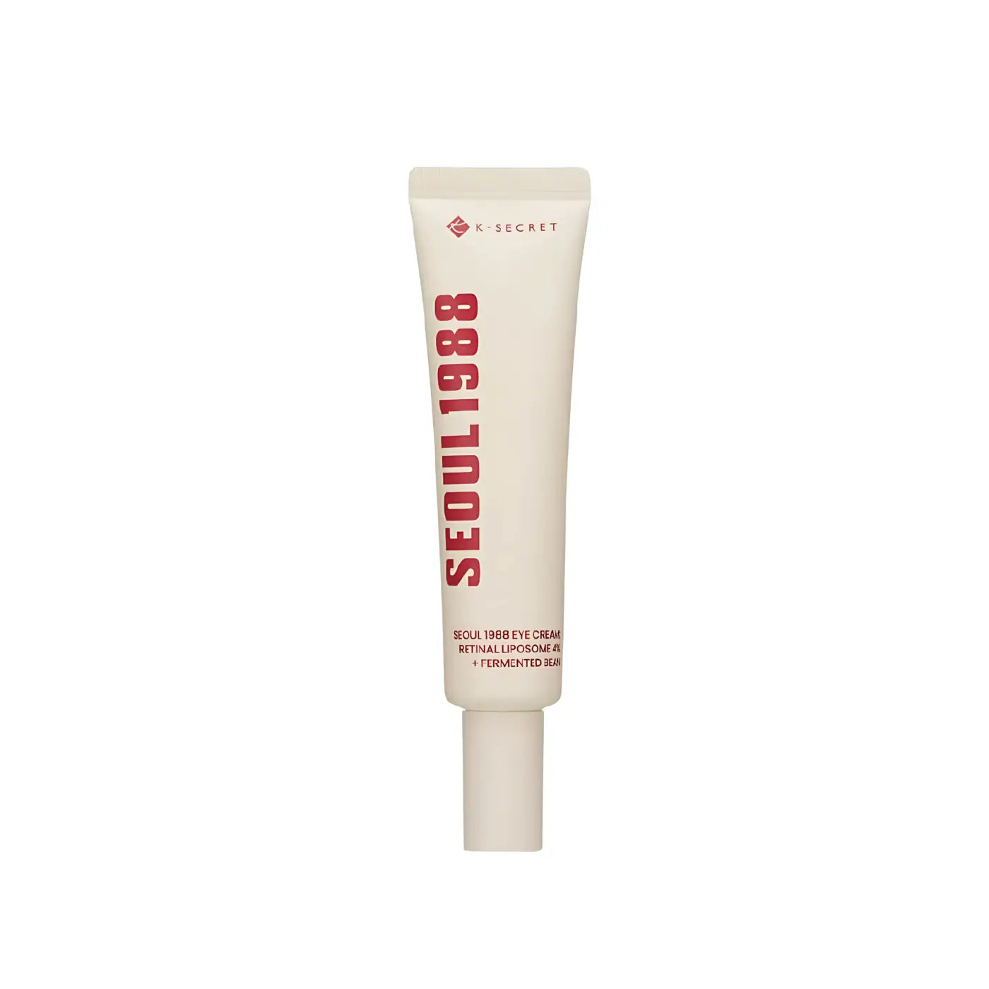 Creamy off-white tube of k-secret seoul 1988 eye cream with retinal liposome 4% for the eye area with bold red lettering