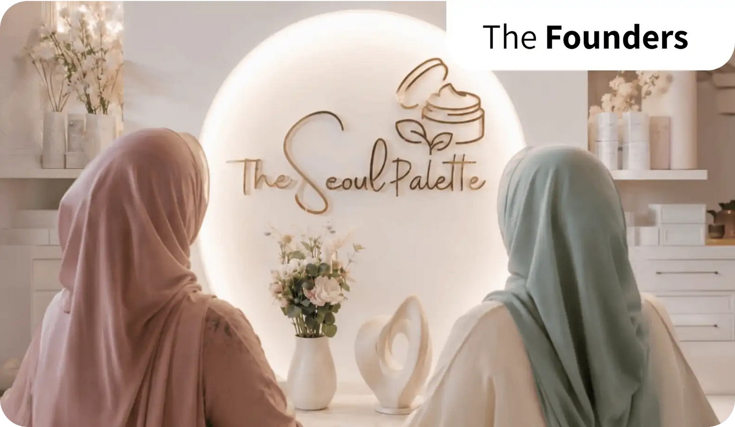 The seoul palette logo, featuring elegant gold cursive lettering and a stylized cream jar with leaves above it.