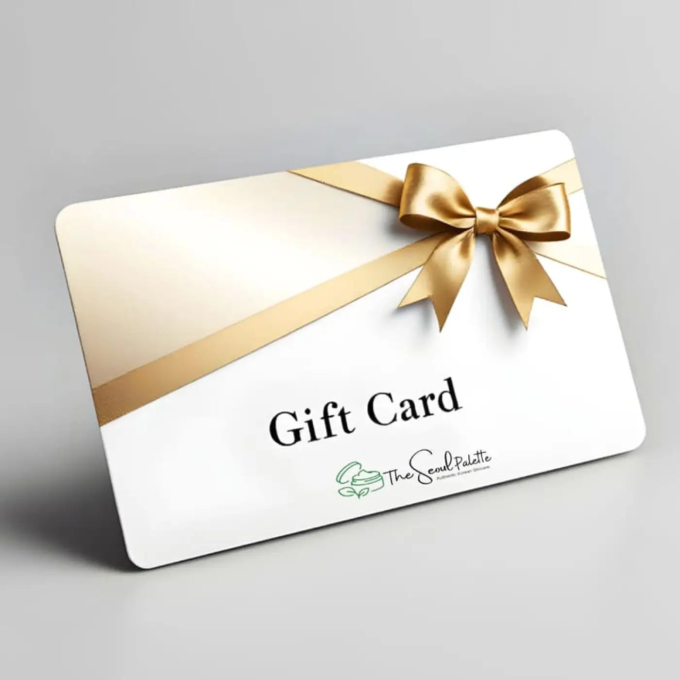 White rectangular seoul palette gift card with shiny gold ribbon bow for authentic korean skincare in south africa