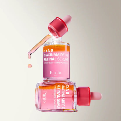 Pink glass dropper bottle of Purito Txa 6 Niacinamide 10 Retinal serum with red cap for skin care use