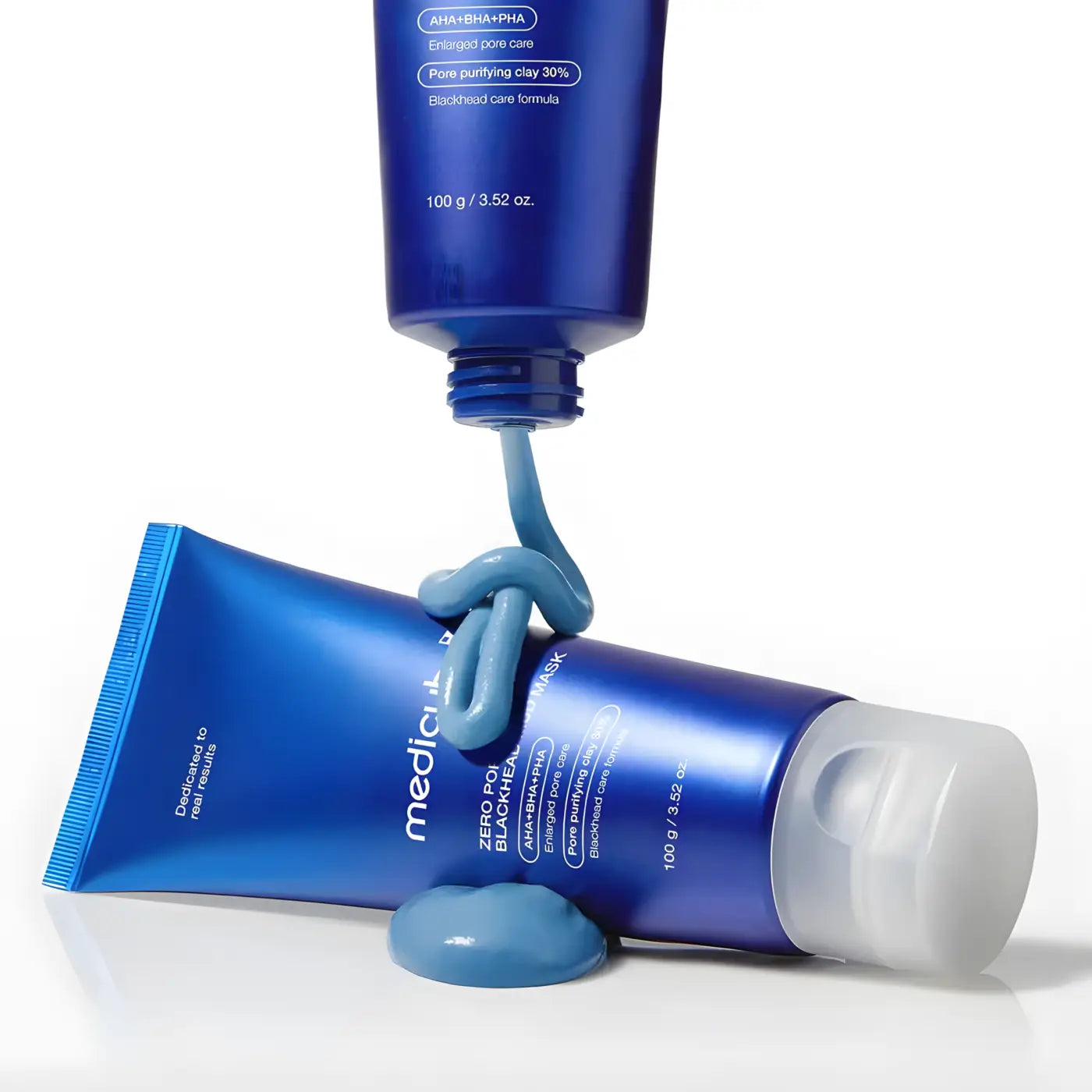 Deep blue matte tube of Mediclinic zero pore blackhead mud mask 100g with white cap and product dollop squeezed out
